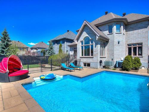 Back facade - 292 Rue Des Alismas, Laval (Sainte-Dorothée), QC - Outdoor With In Ground Pool