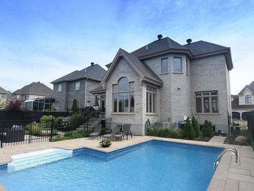 Back facade - 292 Rue Des Alismas, Laval (Sainte-Dorothée), QC - Outdoor With In Ground Pool