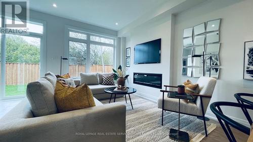 21 Freemon Redmon Circle, Toronto, ON - Indoor Photo Showing Living Room With Fireplace