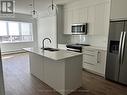 2318 - 395 Skyview Parkway Ne, Calgary, ON  - Indoor Photo Showing Kitchen With Stainless Steel Kitchen With Double Sink With Upgraded Kitchen 