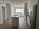 2318 - 395 Skyview Parkway Ne, Calgary, ON  - Indoor Photo Showing Kitchen With Stainless Steel Kitchen With Double Sink With Upgraded Kitchen 