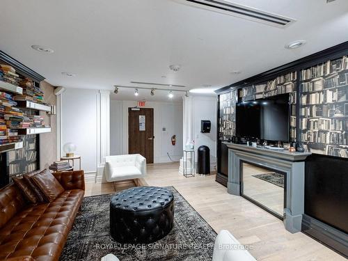 208`-1190 Dundas St E, Toronto, ON - Indoor Photo Showing Living Room With Fireplace