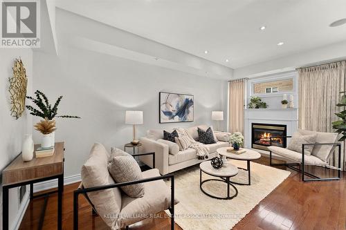 224 - 60 Rosewood Avenue, Mississauga, ON - Indoor Photo Showing Living Room With Fireplace