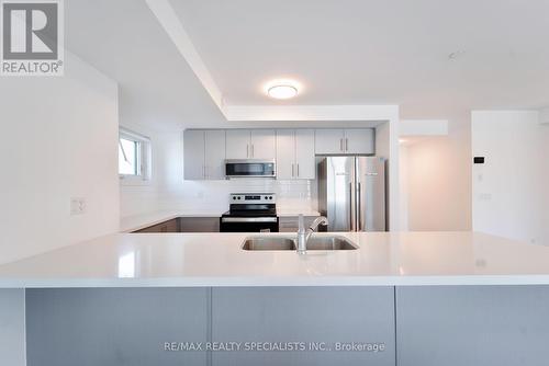 13 - 195 Veterans Drive, Brampton, ON - Indoor Photo Showing Kitchen With Stainless Steel Kitchen With Double Sink With Upgraded Kitchen