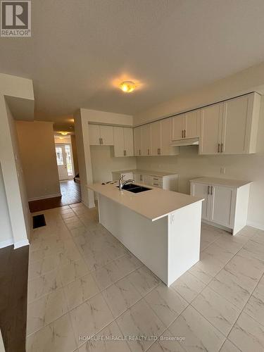 76 Oakmont Drive, Loyalist, ON - Indoor Photo Showing Kitchen With Double Sink