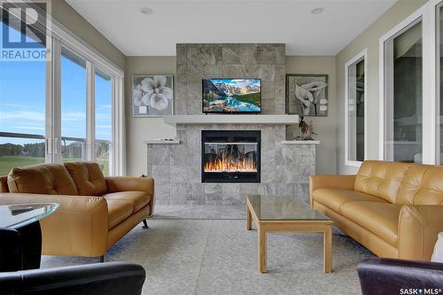 4224 Green Rose Crescent E, Regina, SK - Indoor Photo Showing Living Room With Fireplace