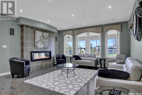 4224 Green Rose Crescent E, Regina, SK - Indoor Photo Showing Living Room With Fireplace