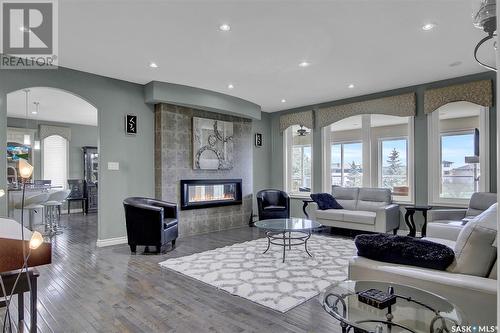 4224 Green Rose Crescent E, Regina, SK - Indoor Photo Showing Living Room With Fireplace