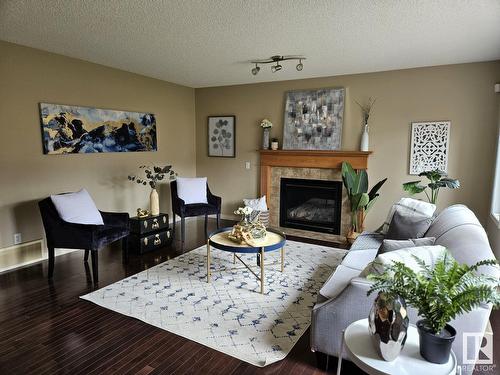 3730 12 St Nw, Edmonton, AB - Indoor Photo Showing Living Room With Fireplace