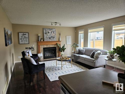 3730 12 St Nw, Edmonton, AB - Indoor Photo Showing Living Room With Fireplace