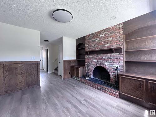 99 Wahstao Cr Nw, Edmonton, AB - Indoor With Fireplace