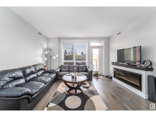 #304 11710 87 Av Nw, Edmonton, AB - Indoor Photo Showing Living Room With Fireplace