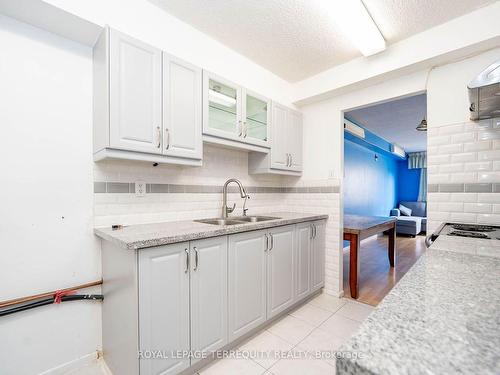 305-10 Tobermory Dr, Toronto, ON - Indoor Photo Showing Kitchen With Double Sink