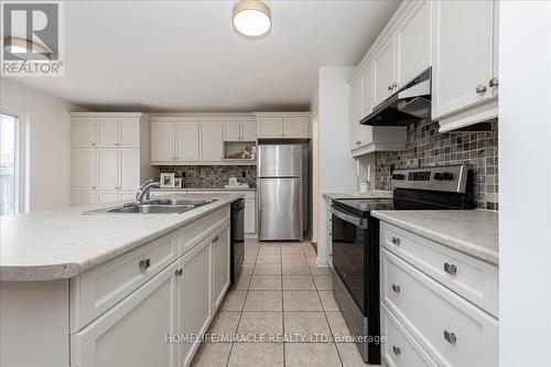 70 Steele Street, New Tecumseth, ON - Indoor Photo Showing Kitchen With Stainless Steel Kitchen With Double Sink