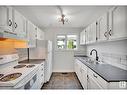 11331 22 Av Nw, Edmonton, AB  - Indoor Photo Showing Kitchen With Double Sink 