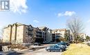 306 - 1450 Bishops Gate, Oakville, ON  - Outdoor With Balcony With Facade 