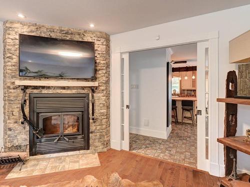 Salle familiale - 1380 Rue De La Réserve, Saint-Lucien, QC - Indoor Photo Showing Living Room With Fireplace