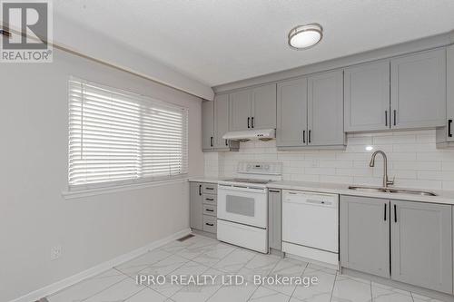 7094 Darcel Avenue, Mississauga, ON - Indoor Photo Showing Kitchen With Double Sink