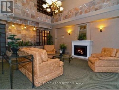 1203 - 5 Lisa Street, Brampton, ON - Indoor Photo Showing Living Room With Fireplace