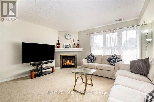 1672 Locksley Lane, Ottawa, ON - Indoor Photo Showing Living Room With Fireplace