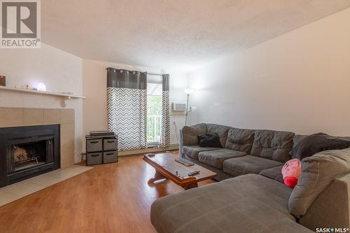 417 2410 Heseltine Road, Regina, SK - Indoor Photo Showing Living Room With Fireplace