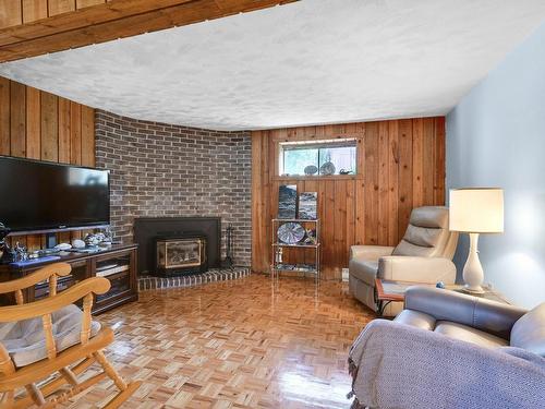 Family room - 284 Rue D'Avaugour, Boucherville, QC - Indoor Photo Showing Living Room With Fireplace