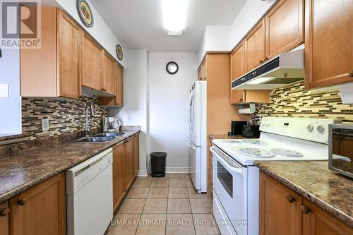 403 - 2088 Lawrence Avenue, Toronto, ON - Indoor Photo Showing Kitchen With Double Sink