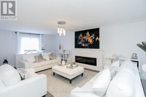 15 Ridge Boulevard, Tillsonburg, ON - Indoor Photo Showing Living Room With Fireplace