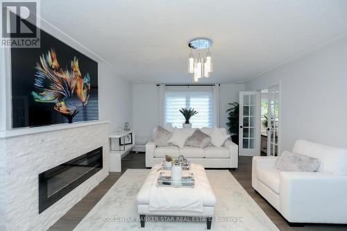 15 Ridge Boulevard, Tillsonburg, ON - Indoor Photo Showing Living Room With Fireplace