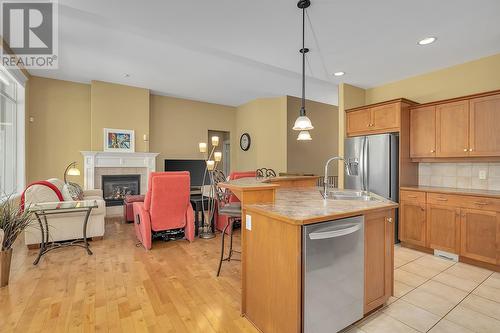 1077 Peak Point Drive, West Kelowna, BC - Indoor Photo Showing Kitchen With Fireplace