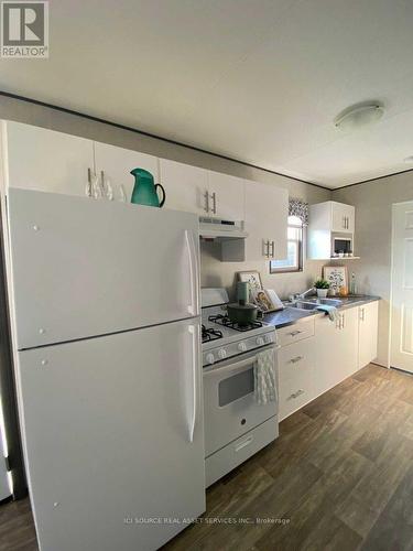 202 - 1501 Line 8 Road, Niagara-On-The-Lake, ON - Indoor Photo Showing Kitchen With Double Sink