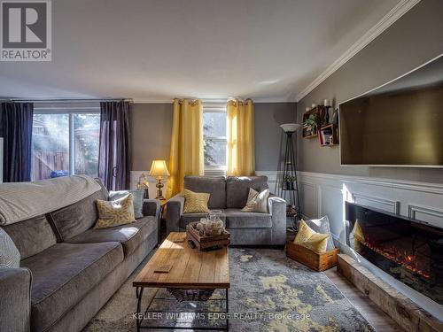 1 - 594 Durham Crescent, Woodstock, ON - Indoor Photo Showing Living Room With Fireplace