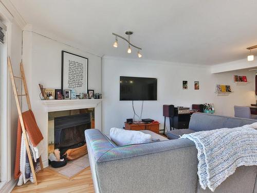 Salon - 1-4245 Boul. Rosemont, Montréal (Rosemont/La Petite-Patrie), QC - Indoor Photo Showing Living Room With Fireplace