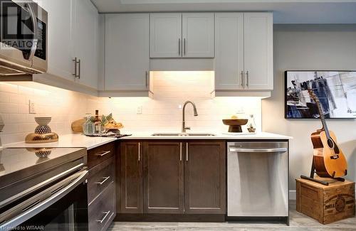 439 Athlone Avenue Unit# D8, Woodstock, ON - Indoor Photo Showing Kitchen With Double Sink