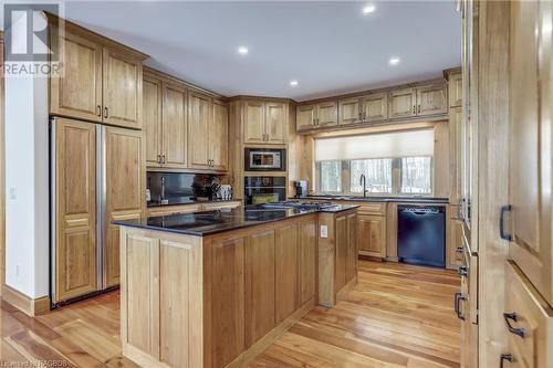 custom kitchen with updated granite counters - 740494 10 Sideroad, Chatsworth (Twp), ON - Indoor Photo Showing Kitchen