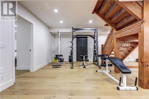 dual access from the main floor and separate entrance to garage / rear private door - 740494 10 Sideroad, Chatsworth (Twp), ON - Indoor Photo Showing Gym Room