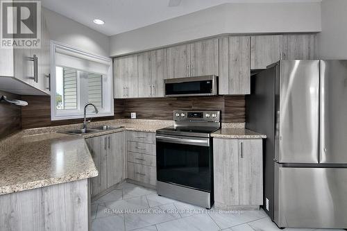 1 - 1 Spruce Street, Wasaga Beach, ON - Indoor Photo Showing Kitchen With Double Sink