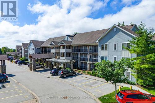 202 - 4 Brandy Lane Drive, Collingwood, ON - Outdoor With Balcony With Facade