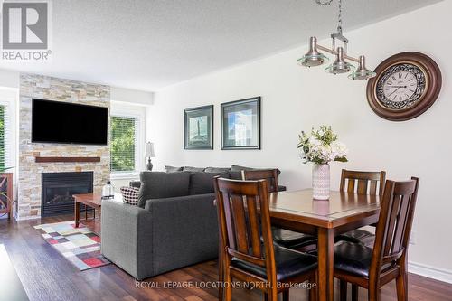 202 - 4 Brandy Lane Drive, Collingwood, ON - Indoor Photo Showing Dining Room With Fireplace