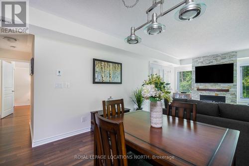 202 - 4 Brandy Lane Drive, Collingwood, ON - Indoor Photo Showing Dining Room With Fireplace