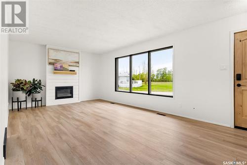 202 Maclean Street, Raymore, SK - Indoor Photo Showing Living Room With Fireplace