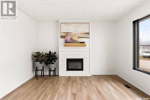 202 Maclean Street, Raymore, SK - Indoor Photo Showing Living Room With Fireplace