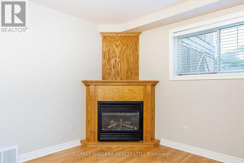 65 Arbour Glen Drive, St. Catharines, ON - Indoor Photo Showing Living Room With Fireplace