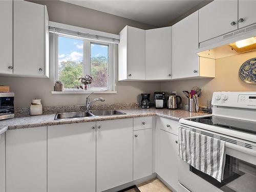 410-2520 Wark St, Victoria, BC - Indoor Photo Showing Kitchen With Double Sink