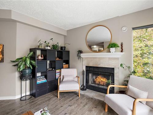 410-2520 Wark St, Victoria, BC - Indoor Photo Showing Living Room With Fireplace