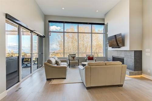 450 Windhover Court, Kelowna, BC - Indoor With Fireplace