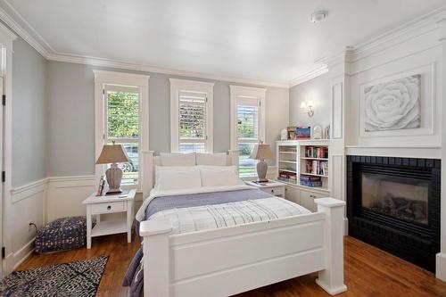 376 Quilchena Drive, Kelowna, BC - Indoor Photo Showing Bedroom With Fireplace