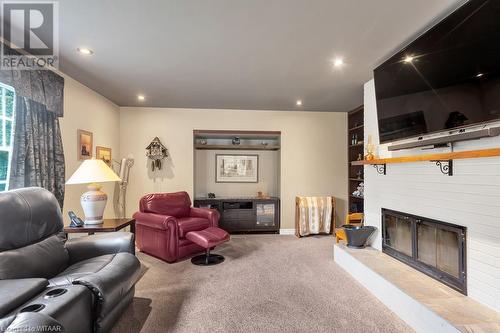 15 Chesham Place, Woodstock, ON - Indoor Photo Showing Living Room With Fireplace