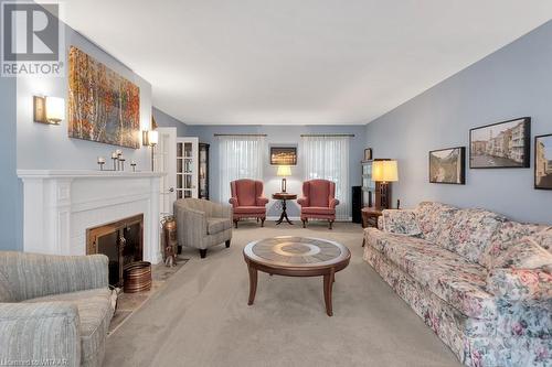 15 Chesham Place, Woodstock, ON - Indoor Photo Showing Living Room With Fireplace