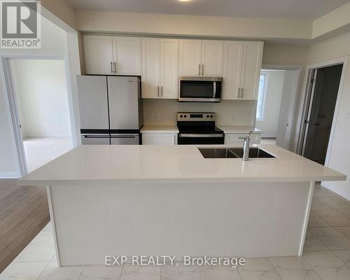 12 Oakmont Drive, Loyalist, ON - Indoor Photo Showing Kitchen With Double Sink